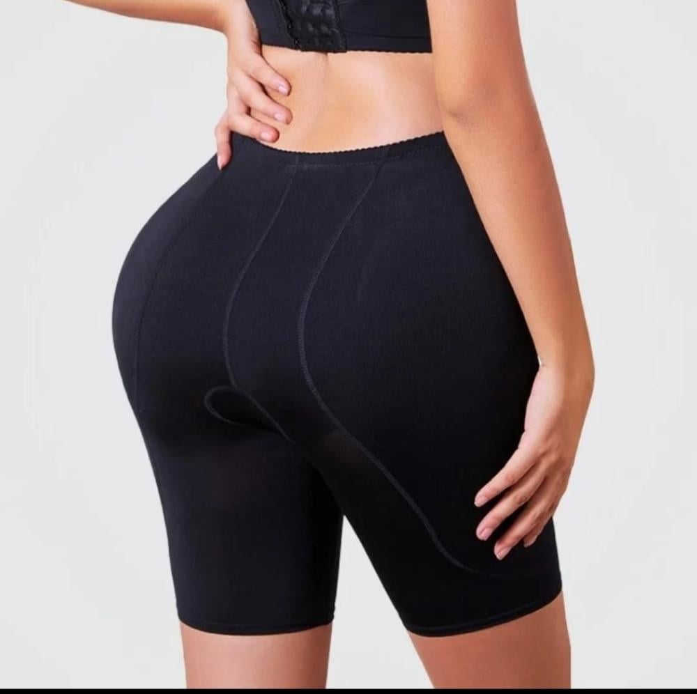 Black shorts to hide the bulge and enlarge the thighs