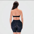 Black shorts to hide the bulge and enlarge the thighs