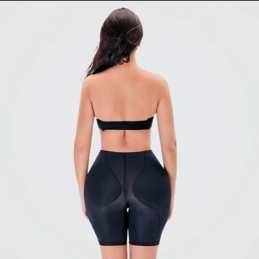 Black shorts to hide the bulge and enlarge the thighs
